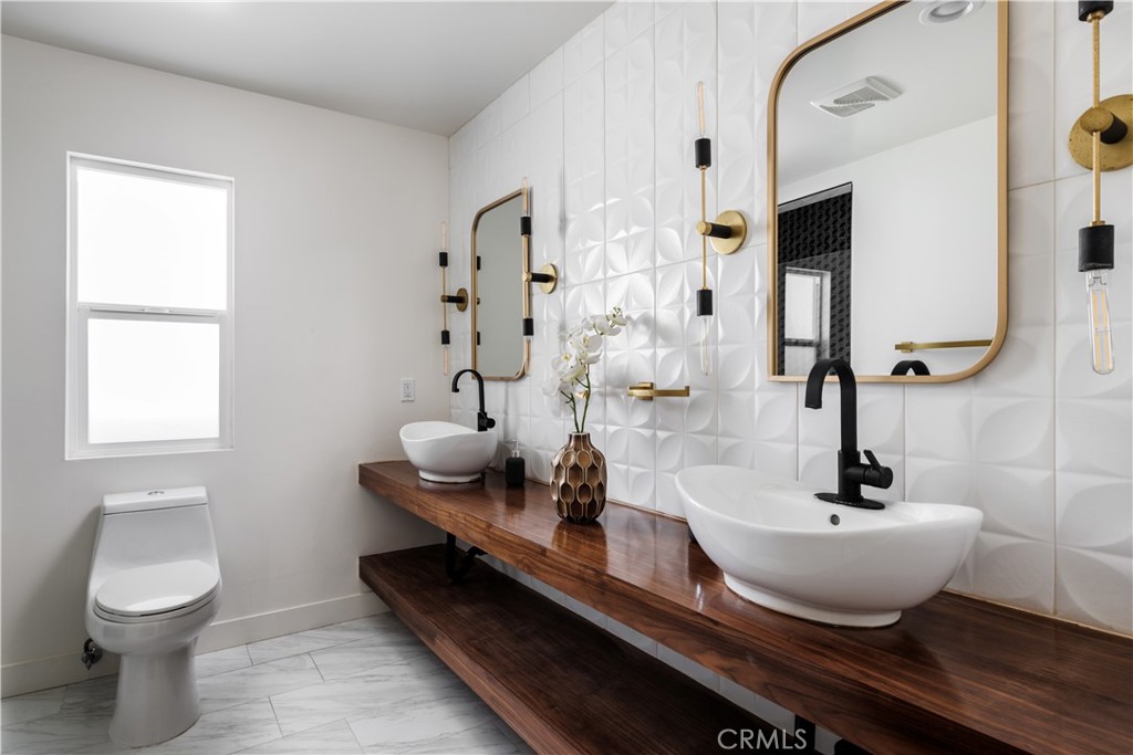 2820 Front Street Alhambra, CA 91803 - Photo 14 of 19 a bathroom with a toilet a sink and mirror