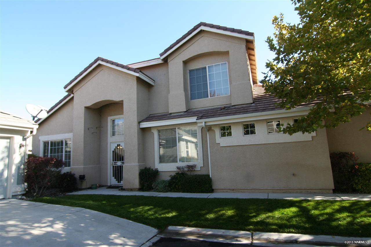 9645 Otter Way Reno, NV 89521 - Photo 1 of 1 a front view of a house with a yard