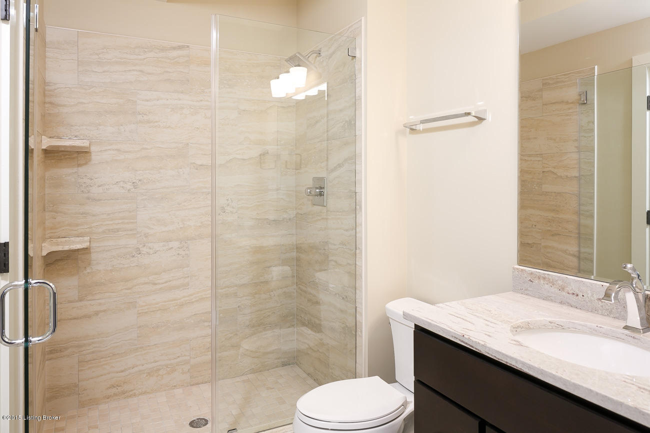 1104 Bellewood Road Anchorage, KY 40223 - Photo 56 of 63 The lower level bath doesn't disappoint with a beautifully tiled shower enclosure and granite vanity top!