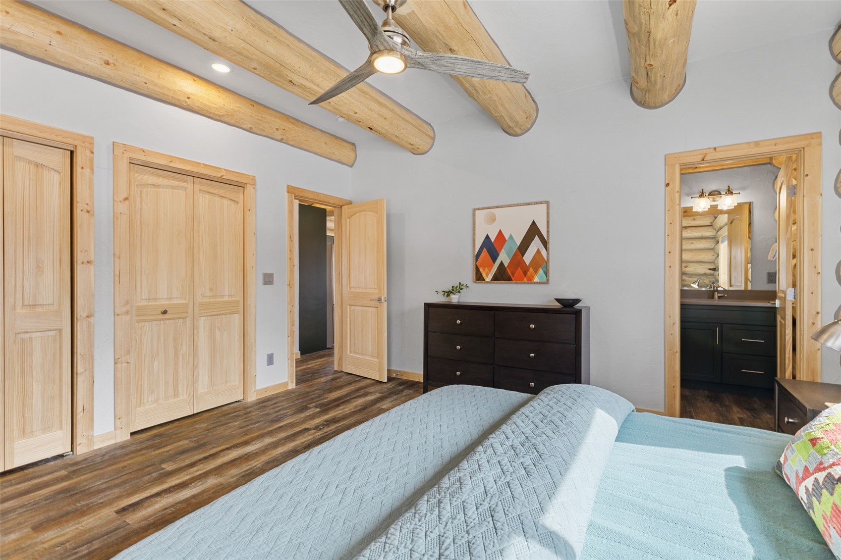 2542 High Creek Road Fairplay, CO 80440 - Photo 16 of 50 a bedroom with a bed and a chandelier