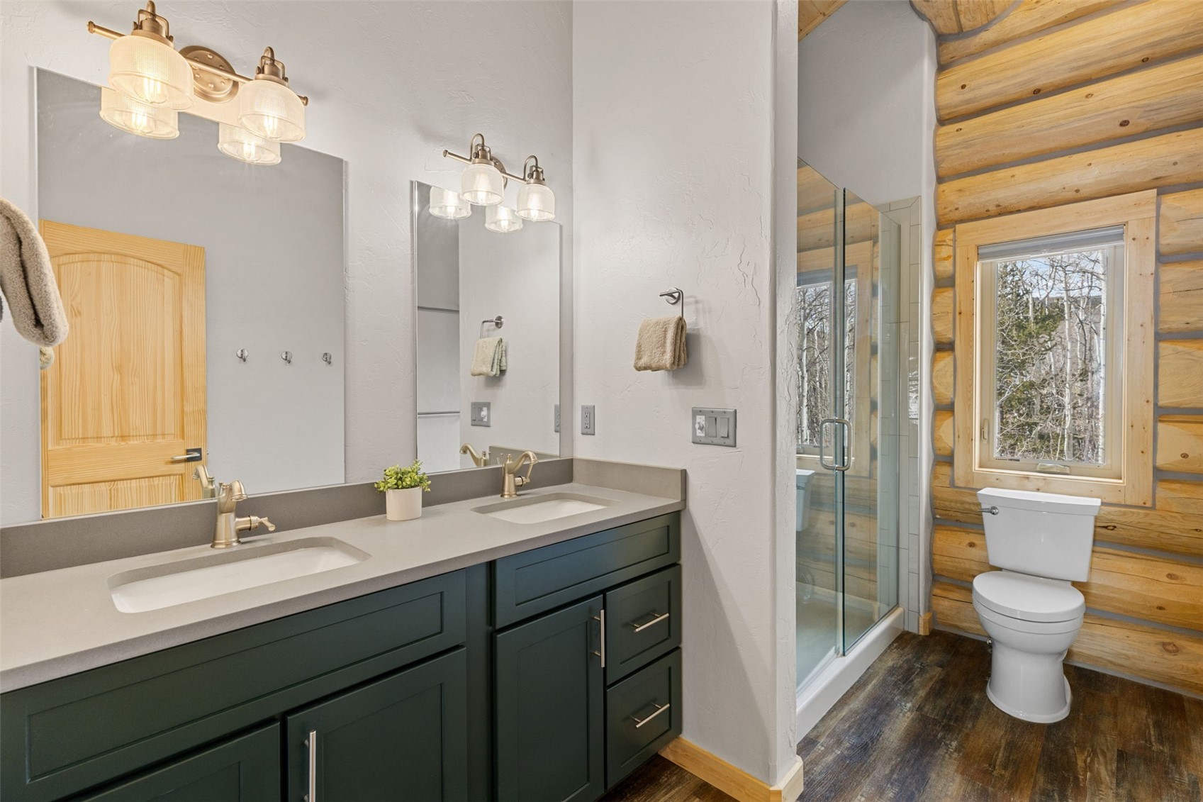 2542 High Creek Road Fairplay, CO 80440 - Photo 30 of 50 a bathroom with a sink a toilet a large mirror and shower