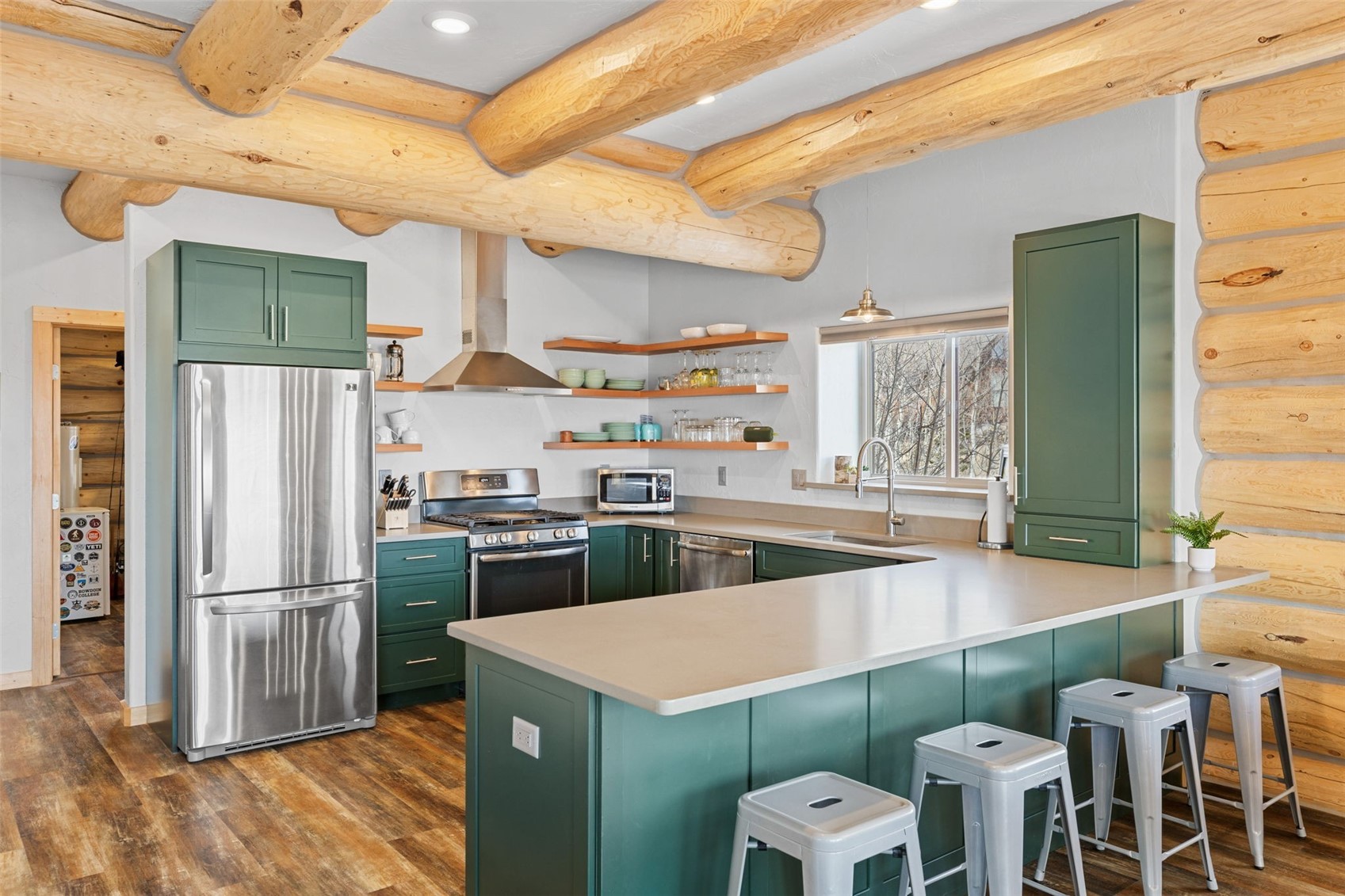 2542 High Creek Road Fairplay, CO 80440 - Photo 9 of 50 a kitchen with stainless steel appliances kitchen island granite countertop a refrigerator a stove and a sink with cabinets