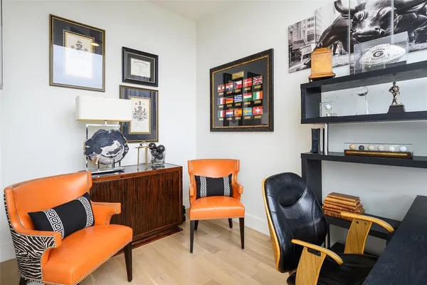 a blue room with furniture and a chair