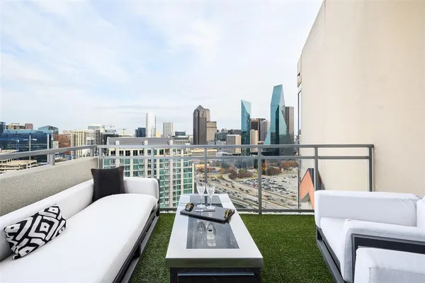 a view of roof deck with furniture
