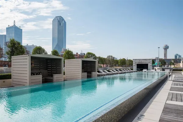 a view of swimming pool with outdoor seating and yard