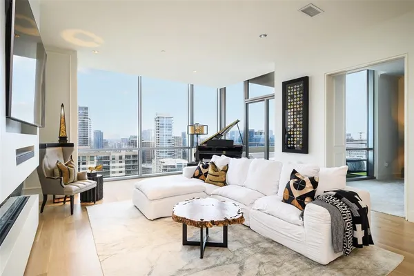 a living room with furniture and a large window
