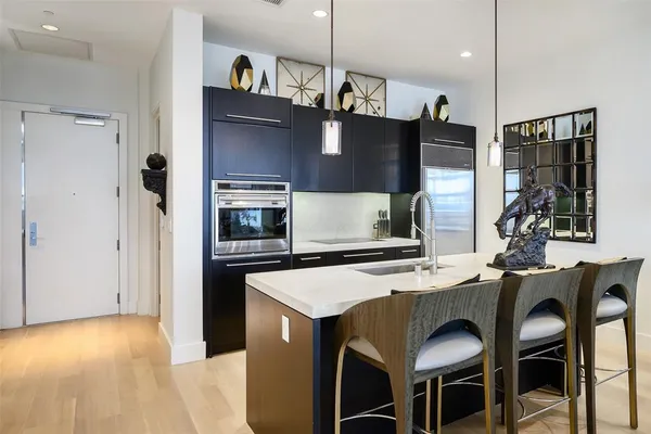 a kitchen with a table and chairs in it