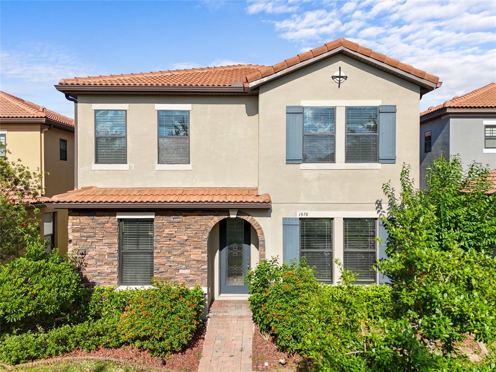 1978 Fishtail Fern Way Ocoee, FL 34761 - Photo 1 of 1 a front view of a house with a yard