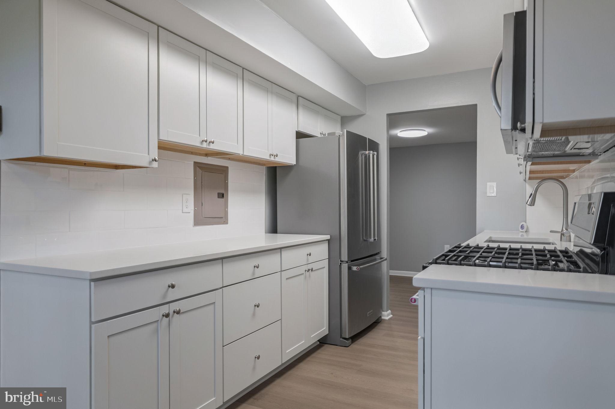 3356 Woodburn Road, Unit T3 Annandale, VA 22003 - Photo 13 of 35 a kitchen with cabinets and window