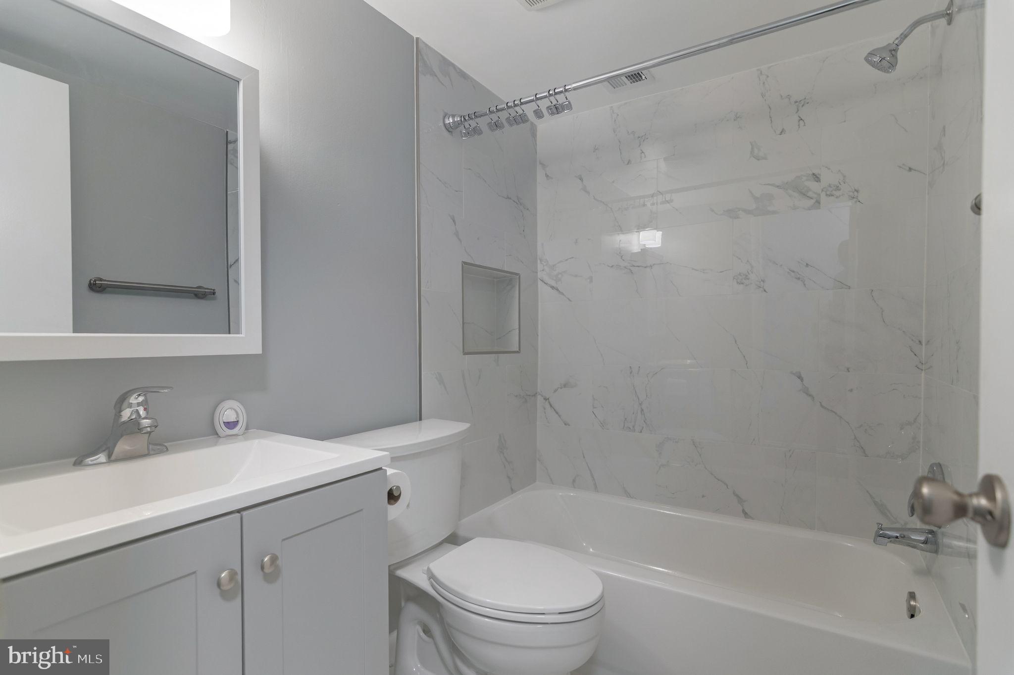 3356 Woodburn Road, Unit T3 Annandale, VA 22003 - Photo 26 of 35 a bathroom with a sink mirror toilet and bathtub