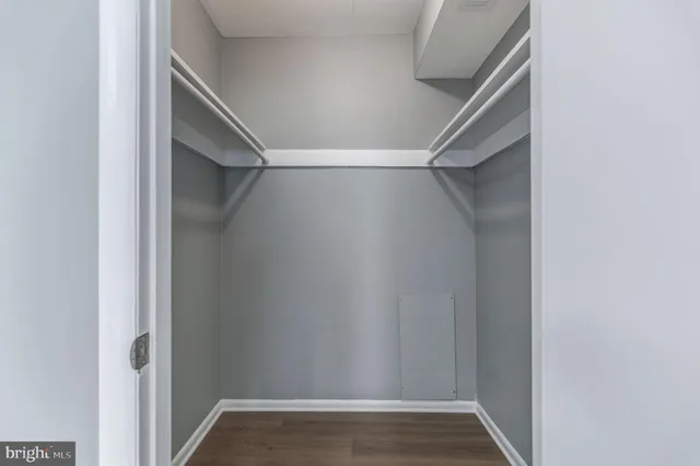 a view of an empty walk in closet
