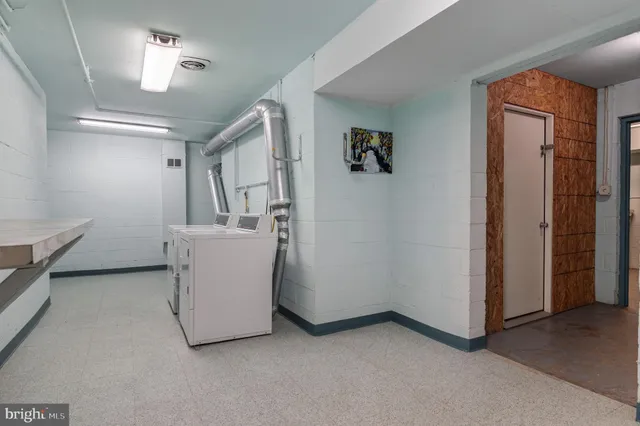 a view of a room with gym equipment and windows