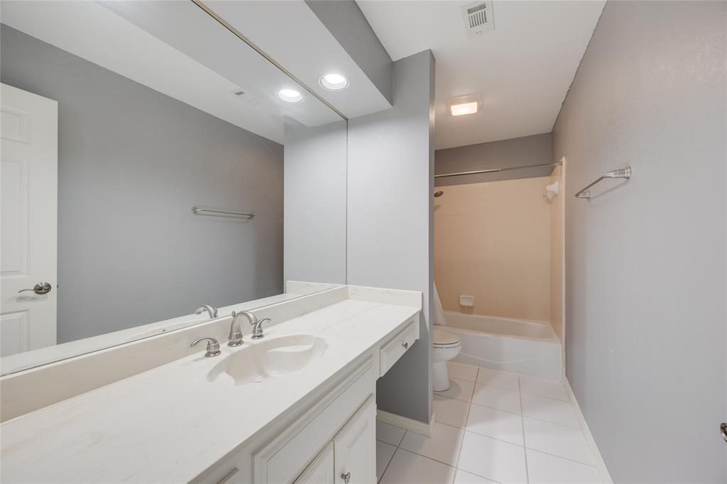 1201 Findlay Drive Arlington, TX 76012 - Photo 26 of 35 a bathroom with a sink and a mirror