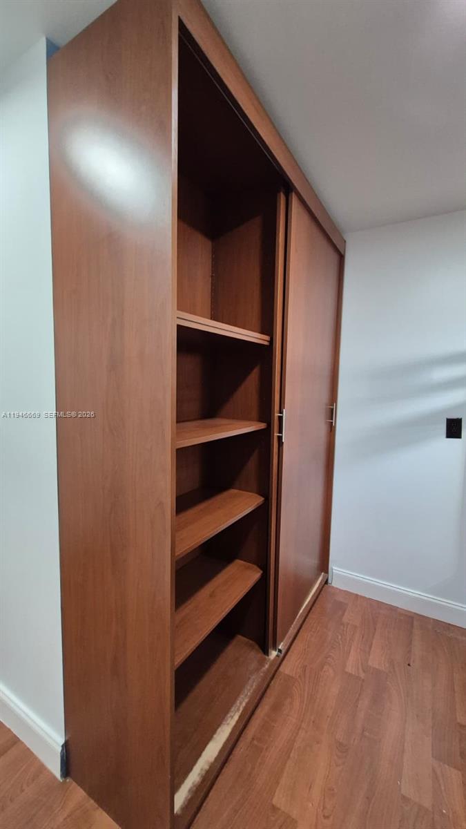 8531 Southwest 109th Avenue Miami, FL 33173 - Photo 18 of 19 a view of walk in closet with empty racks