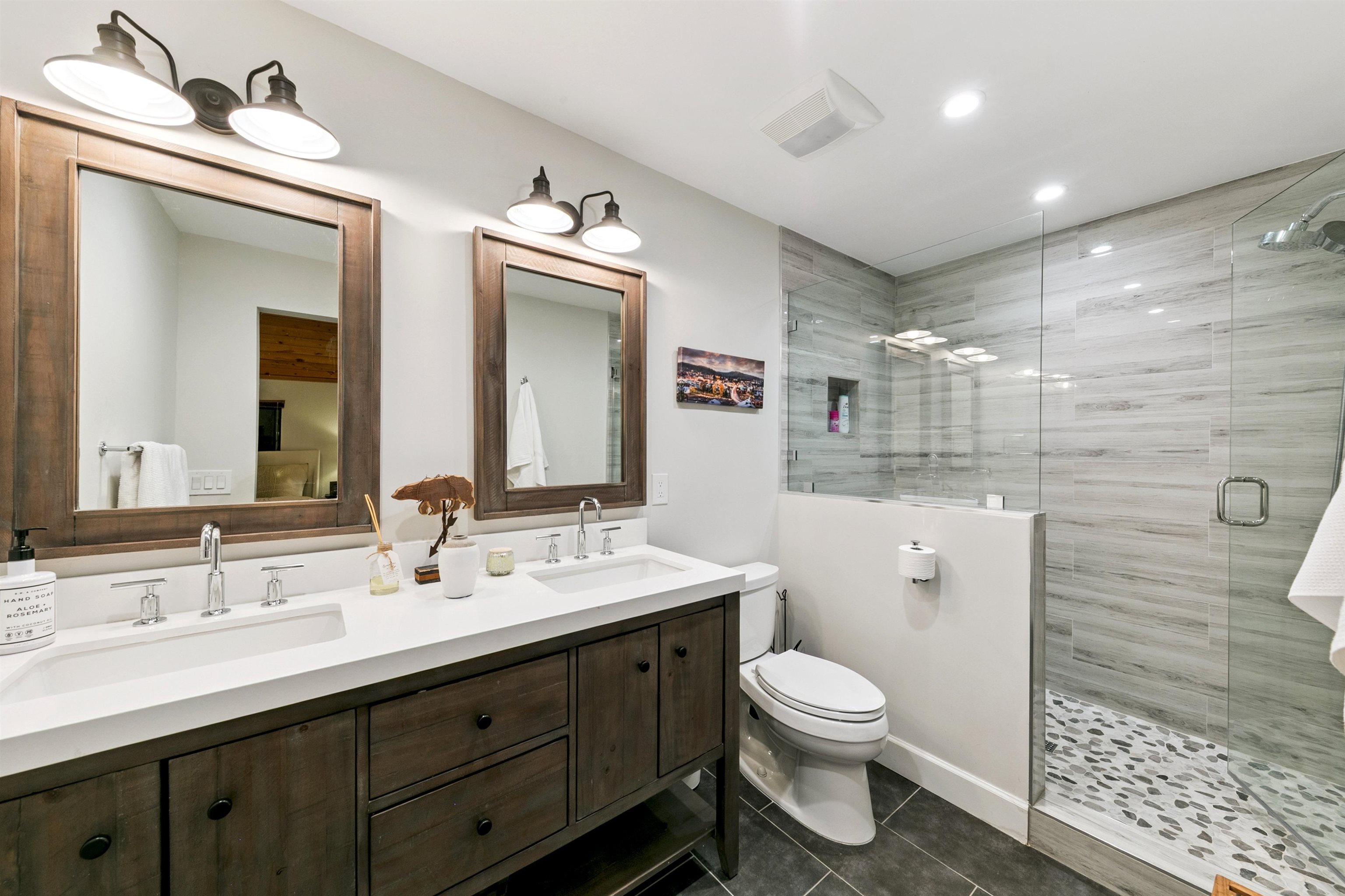 12095 Oslo Drive Truckee, CA 96161 - Photo 16 of 28 a bathroom with a toilet sink and mirror