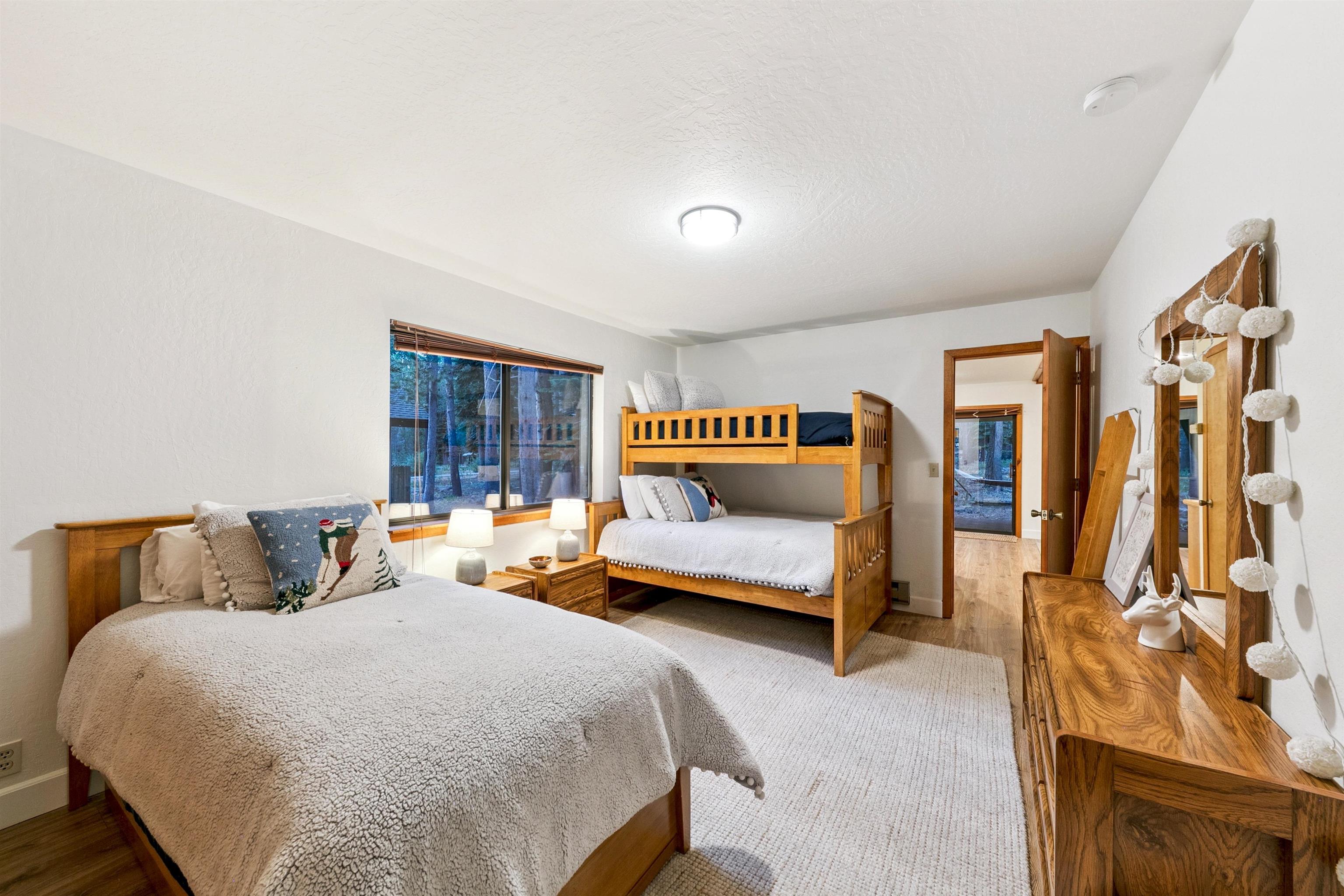 12095 Oslo Drive Truckee, CA 96161 - Photo 19 of 28 a bedroom with a bed and wooden floor