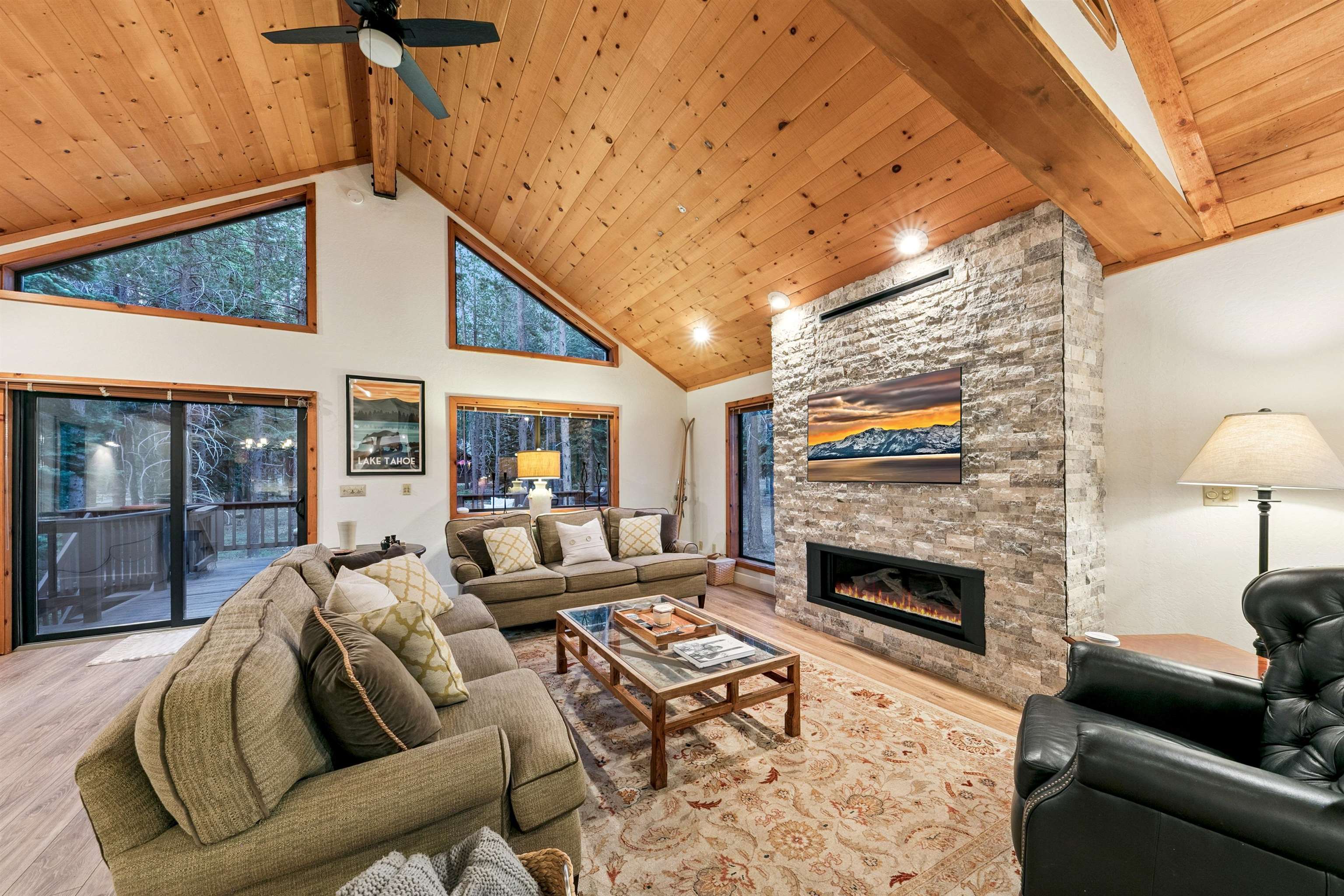 12095 Oslo Drive Truckee, CA 96161 - Photo 6 of 28 a living room with furniture fireplace and a flat screen tv