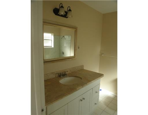 22747 Southwest 55th Way Boca Raton, FL 33433 - Photo 7 of 15 a bathroom with a sink and a mirror