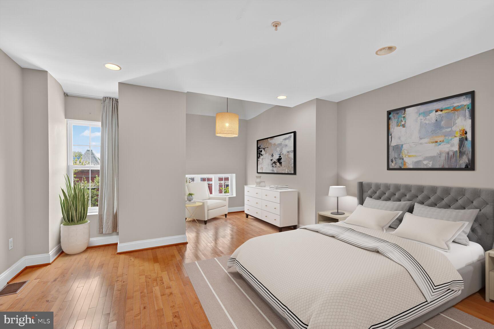 1730 1st Street Northwest, Unit 2 Washington, DC 20001 - Photo 13 of 27 a bedroom with a large bed and a painting on the wall