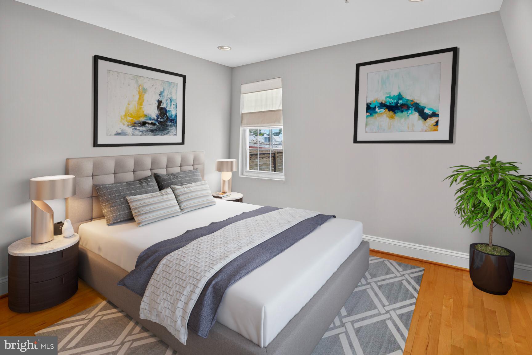 1730 1st Street Northwest, Unit 2 Washington, DC 20001 - Photo 16 of 27 a bedroom with bed and a painting on the wall