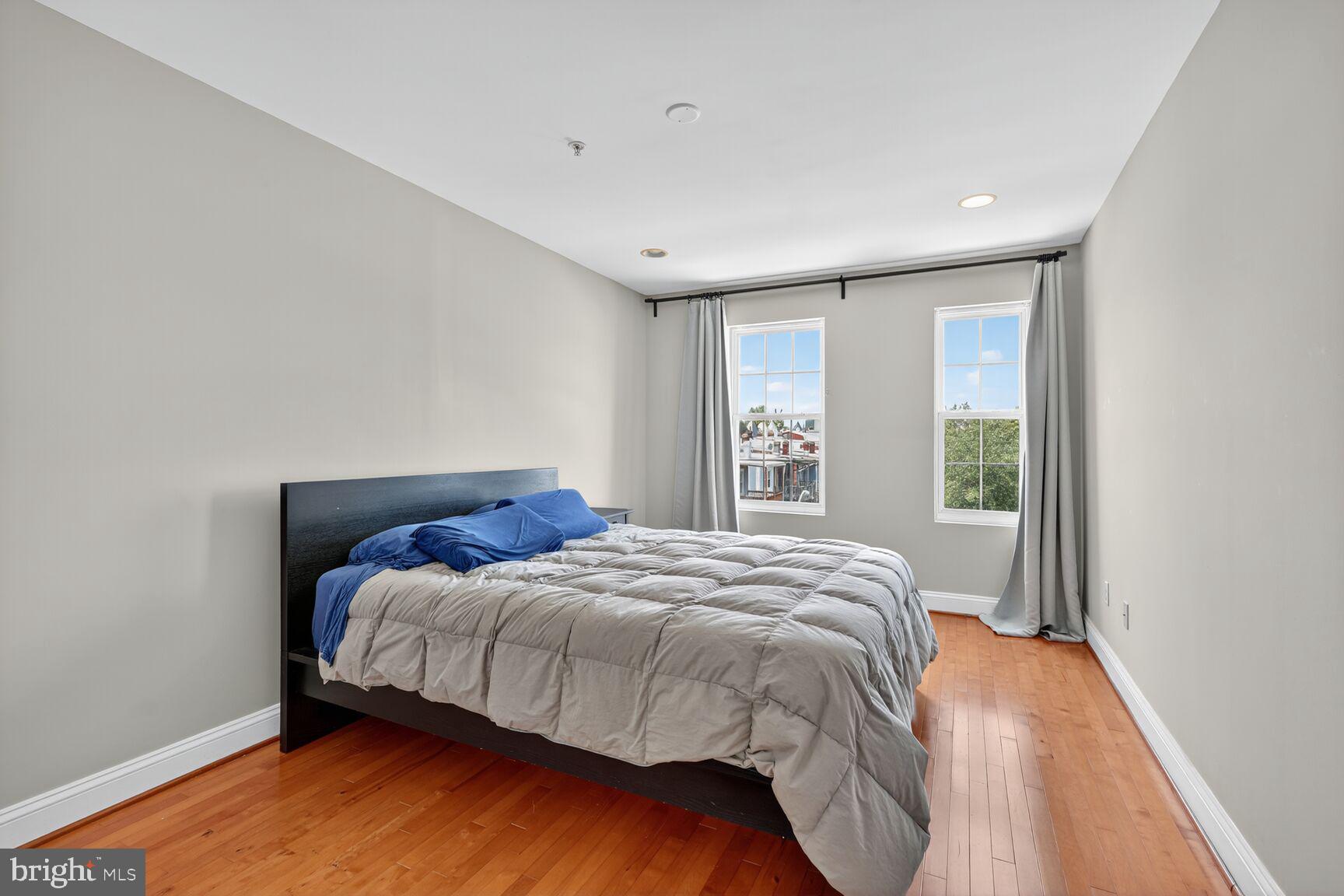 1730 1st Street Northwest, Unit 2 Washington, DC 20001 - Photo 18 of 27 a bedroom with a bed and a window