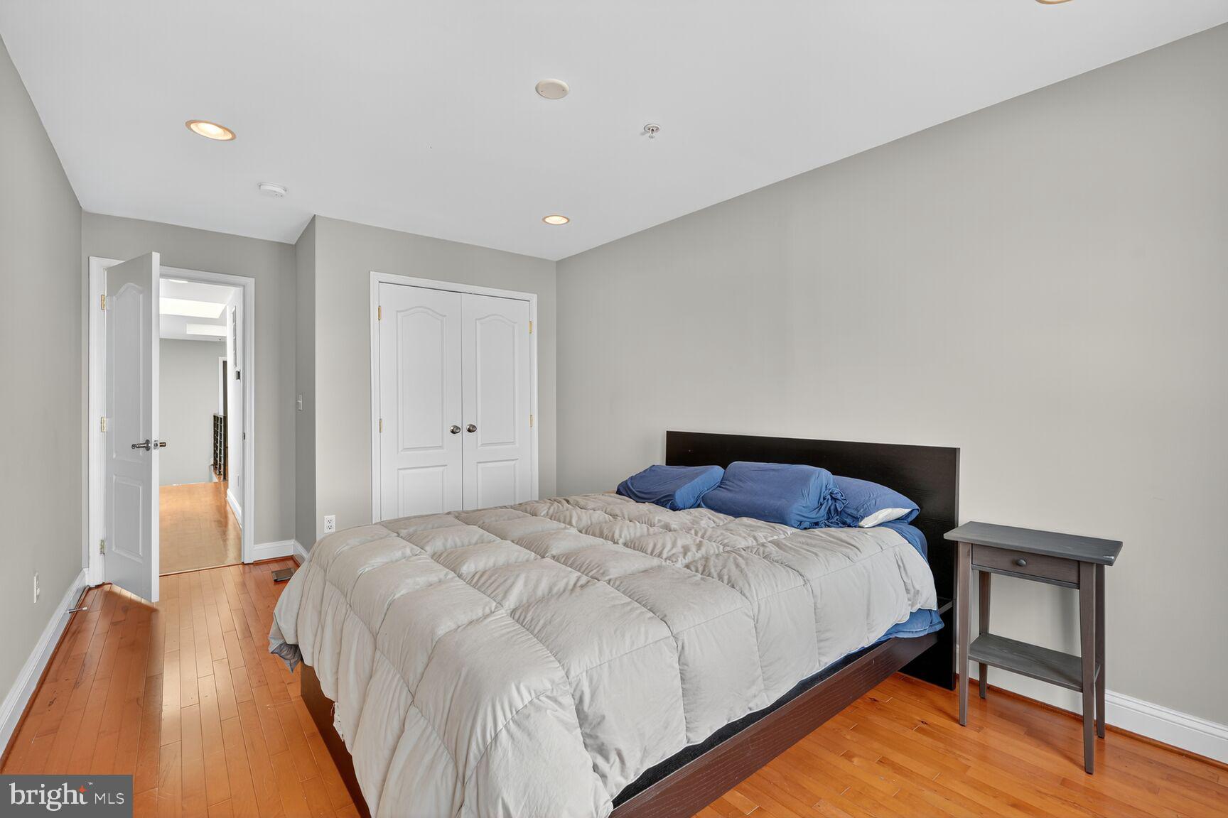 1730 1st Street Northwest, Unit 2 Washington, DC 20001 - Photo 19 of 27 a bedroom with a bed and a table