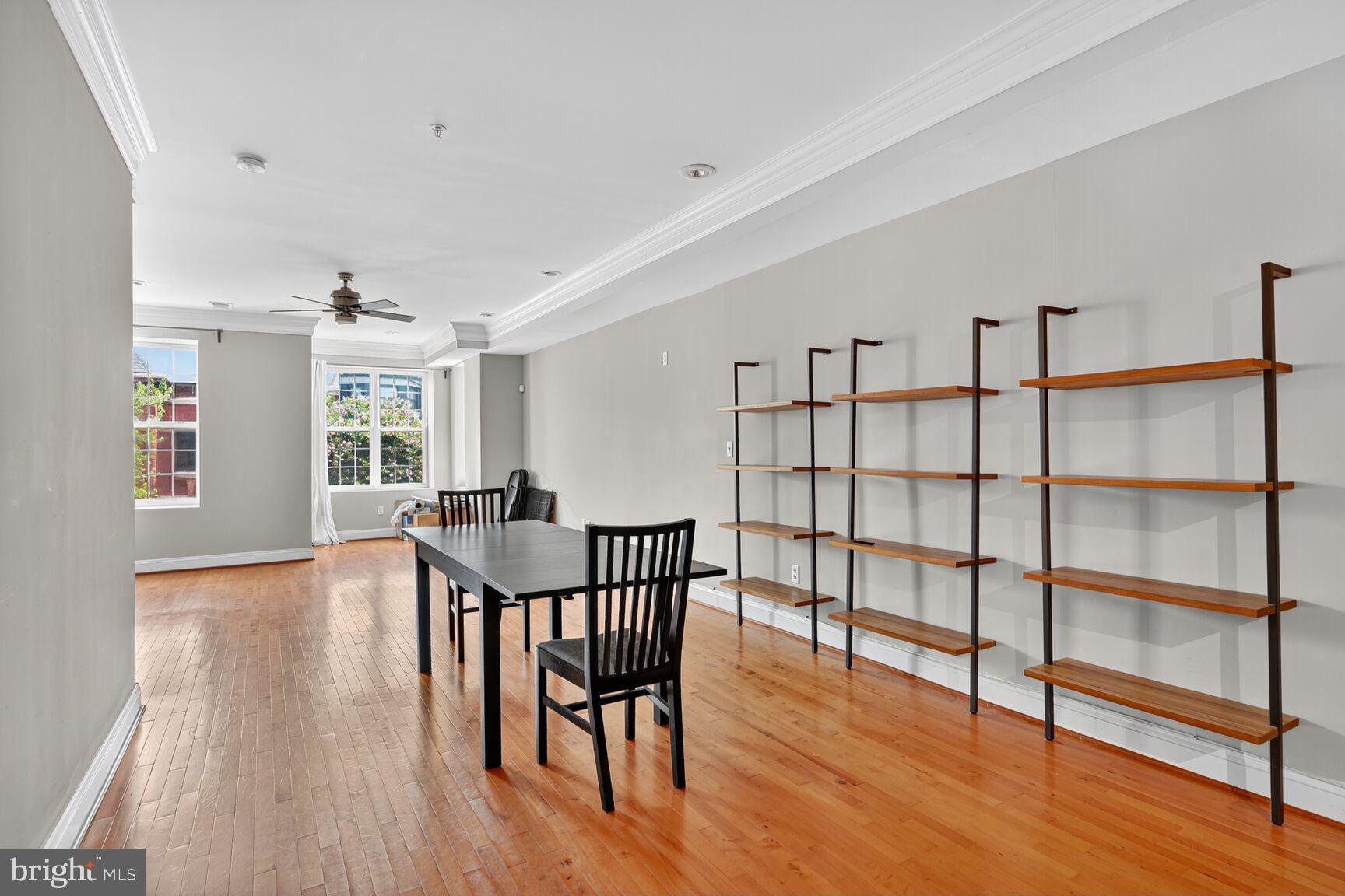 1730 1st Street Northwest, Unit 2 Washington, DC 20001 - Photo 4 of 27 a view of a livingroom with furniture window and wooden floor