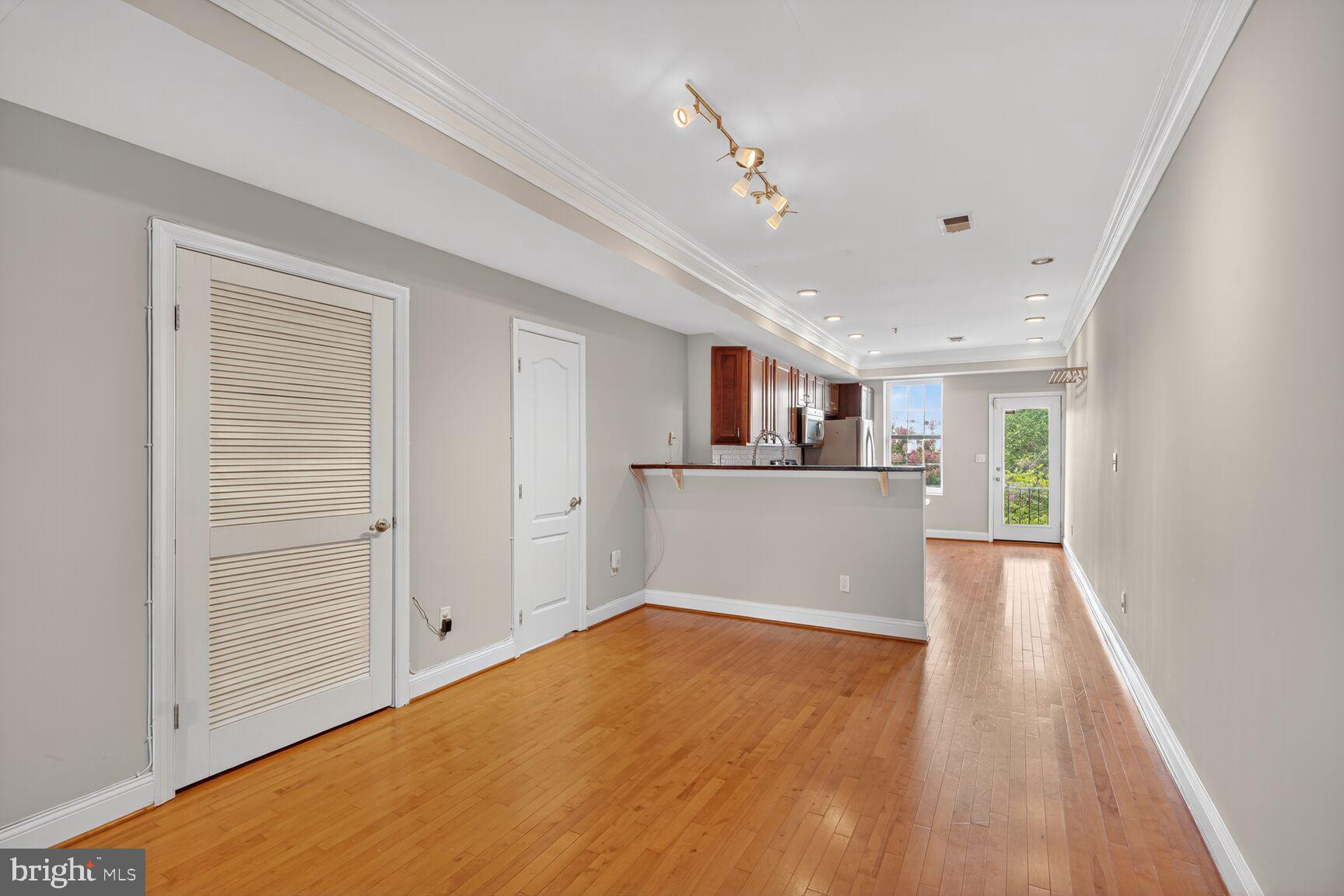 1730 1st Street Northwest, Unit 2 Washington, DC 20001 - Photo 6 of 27 a view of a kitchen with wooden floor and a kitchen