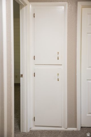 634 South 2100th Street West Vernal, UT 84078 - Photo 30 of 71 Built-in cabinetry with two white panel doors and decorative brass hardware