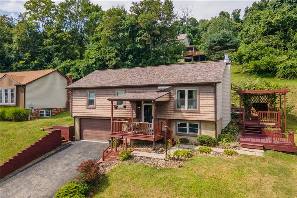 227 Davidson Drive Charleroi, PA 15022 - Photo 27 of 40 a house view with a seating space and garden