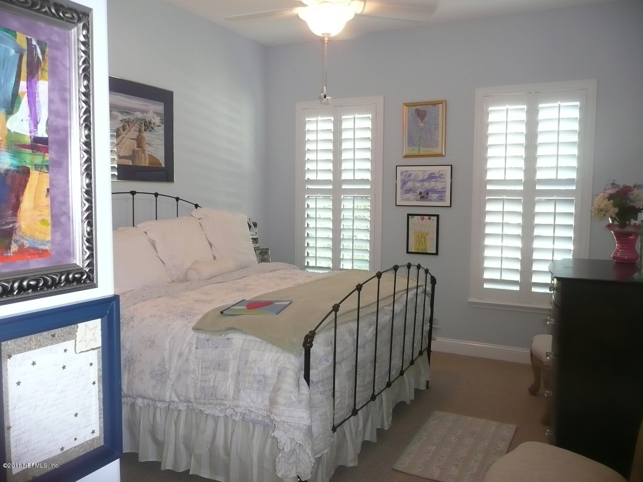 308 Mission Trace Drive St. Augustine, FL 32084 - Photo 16 of 20 a bedroom with a bed and a window