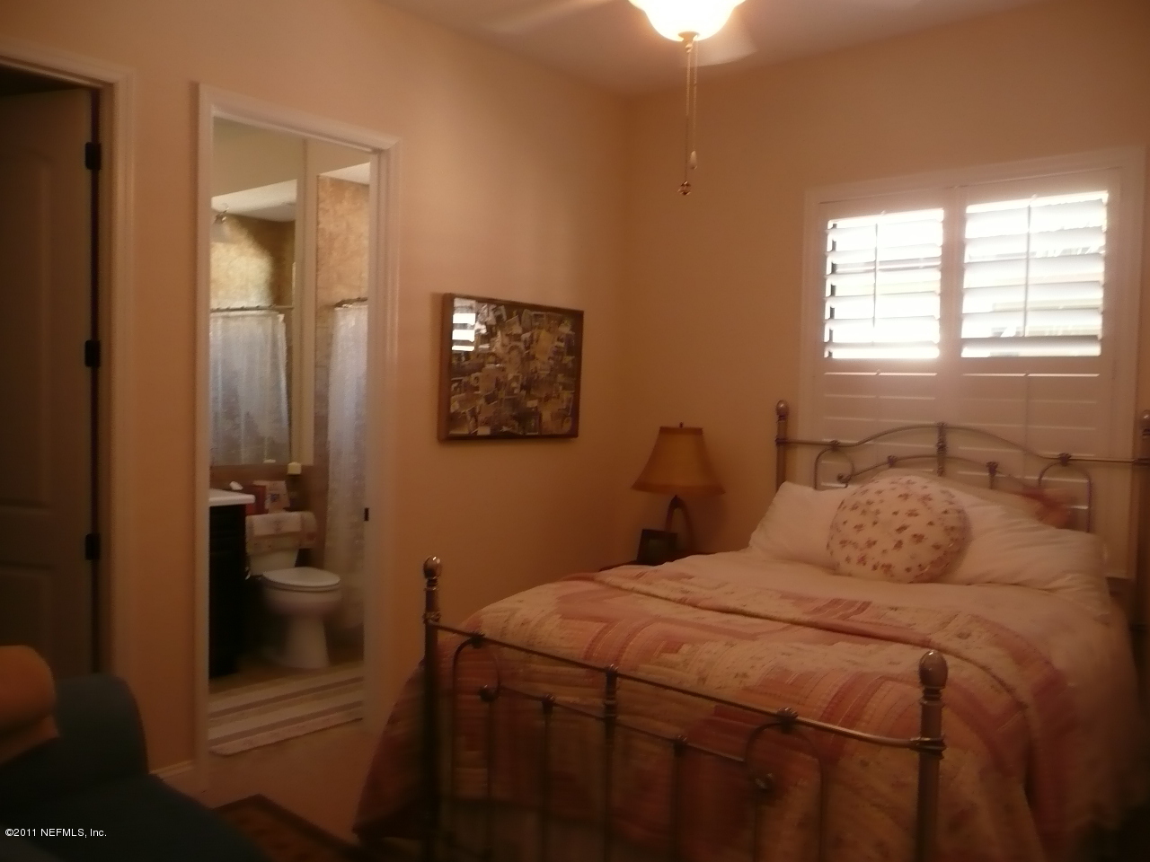 308 Mission Trace Drive St. Augustine, FL 32084 - Photo 18 of 20 a bedroom with a bed and a view of bathroom