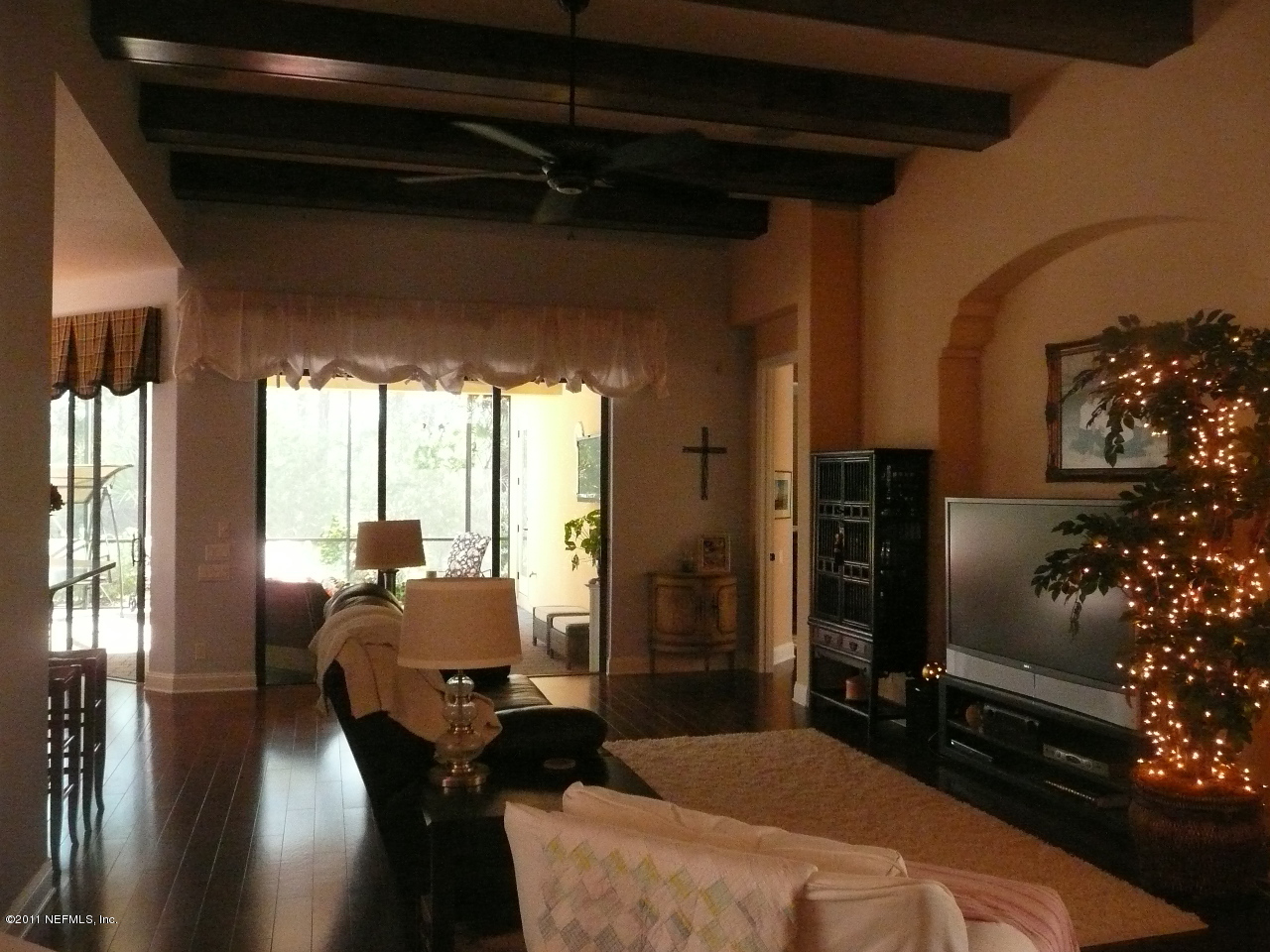 308 Mission Trace Drive St. Augustine, FL 32084 - Photo 3 of 20 a living room with furniture and a floor to ceiling window