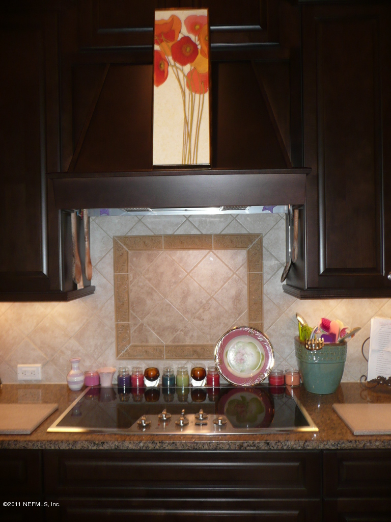 308 Mission Trace Drive St. Augustine, FL 32084 - Photo 8 of 20 a bathroom with a sink and a mirror