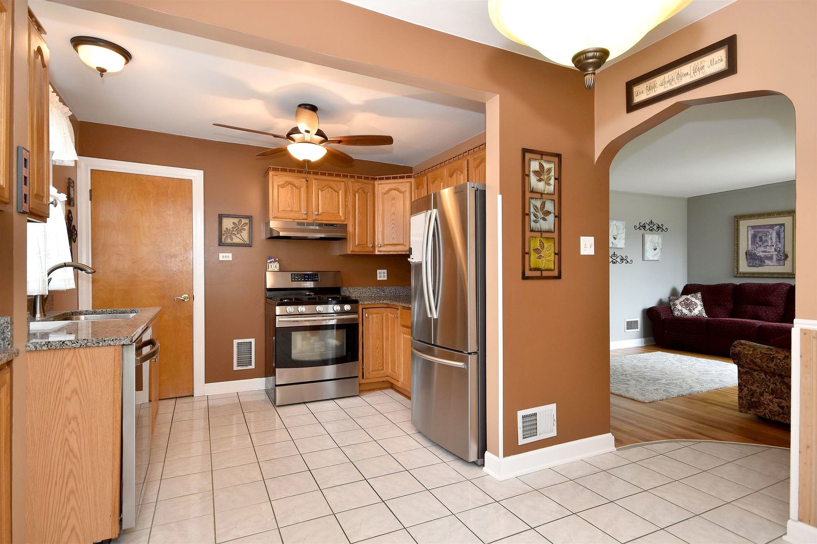 8423 Riverside Avenue Brookfield, IL 60513 - Photo 11 of 28 a kitchen with granite countertop a refrigerator and a stove