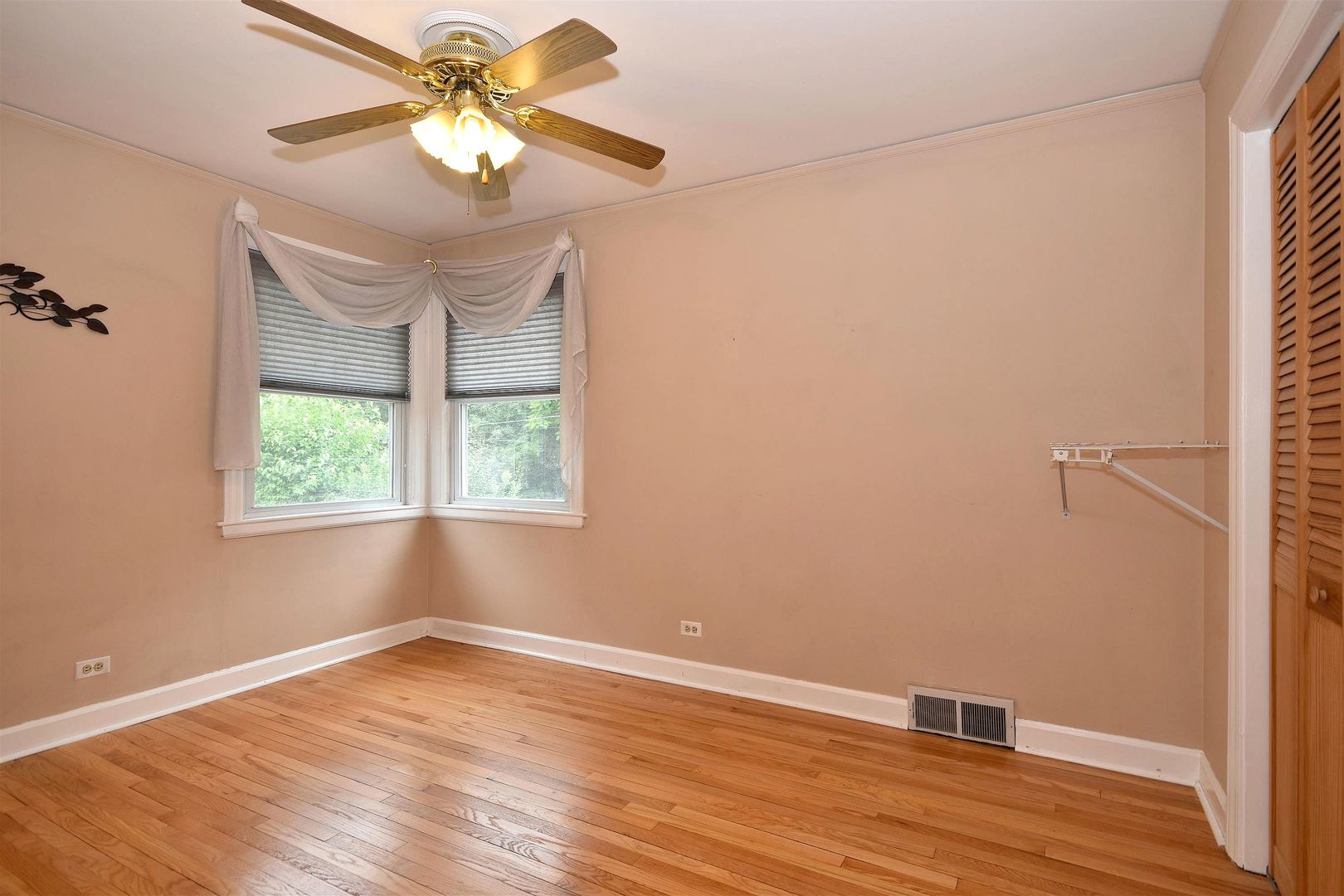 8423 Riverside Avenue Brookfield, IL 60513 - Photo 14 of 28 a view of an empty room with window and wooden floor