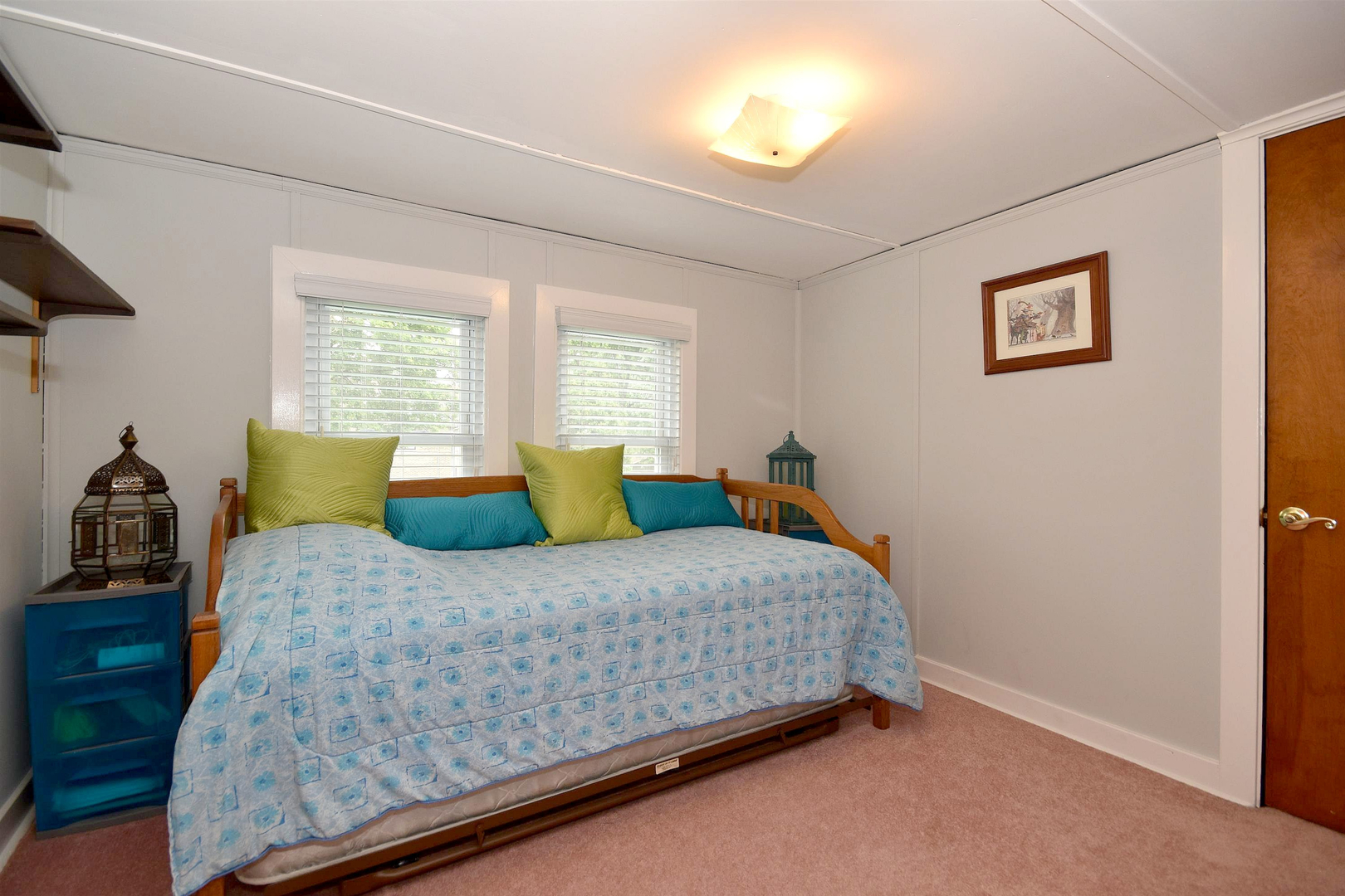 8423 Riverside Avenue Brookfield, IL 60513 - Photo 17 of 28 a bedroom with a bed and two windows