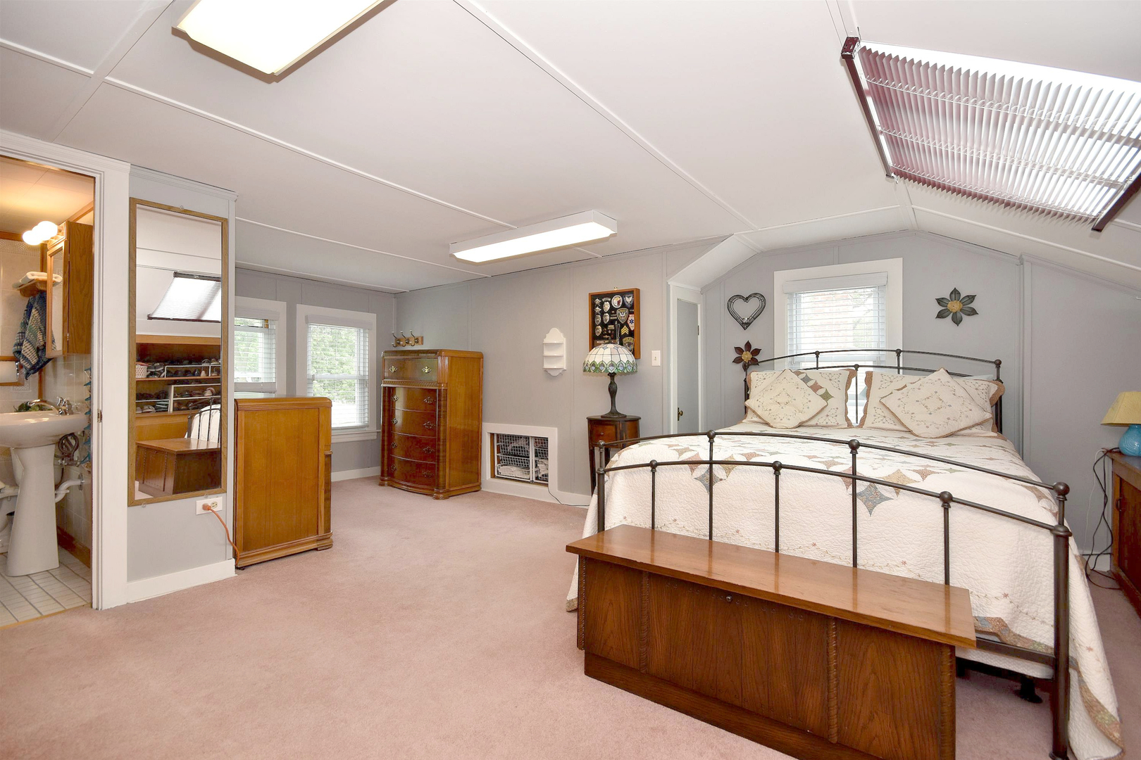 8423 Riverside Avenue Brookfield, IL 60513 - Photo 19 of 28 a spacious bedroom with a bed and a walk in closet