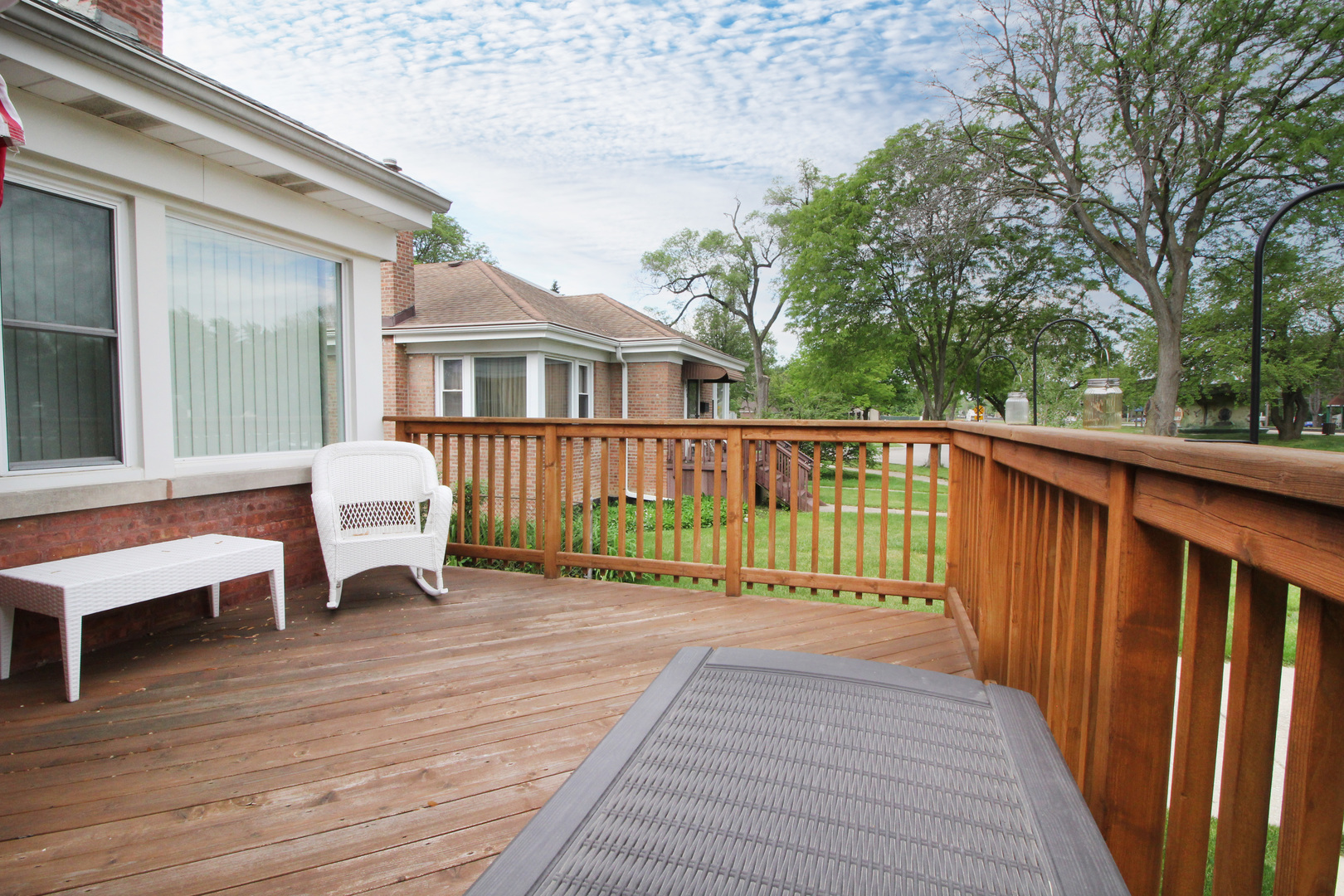 8423 Riverside Avenue Brookfield, IL 60513 - Photo 3 of 28 a view of a chair and table on the wooden floor