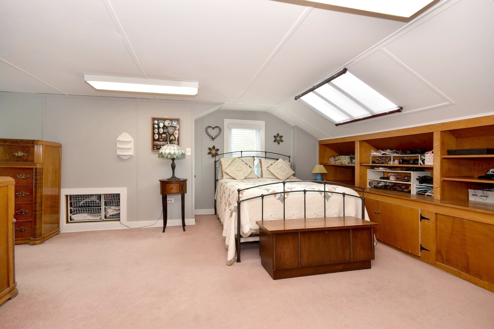 8423 Riverside Avenue Brookfield, IL 60513 - Photo 21 of 28 a bedroom with furniture and a flat screen tv