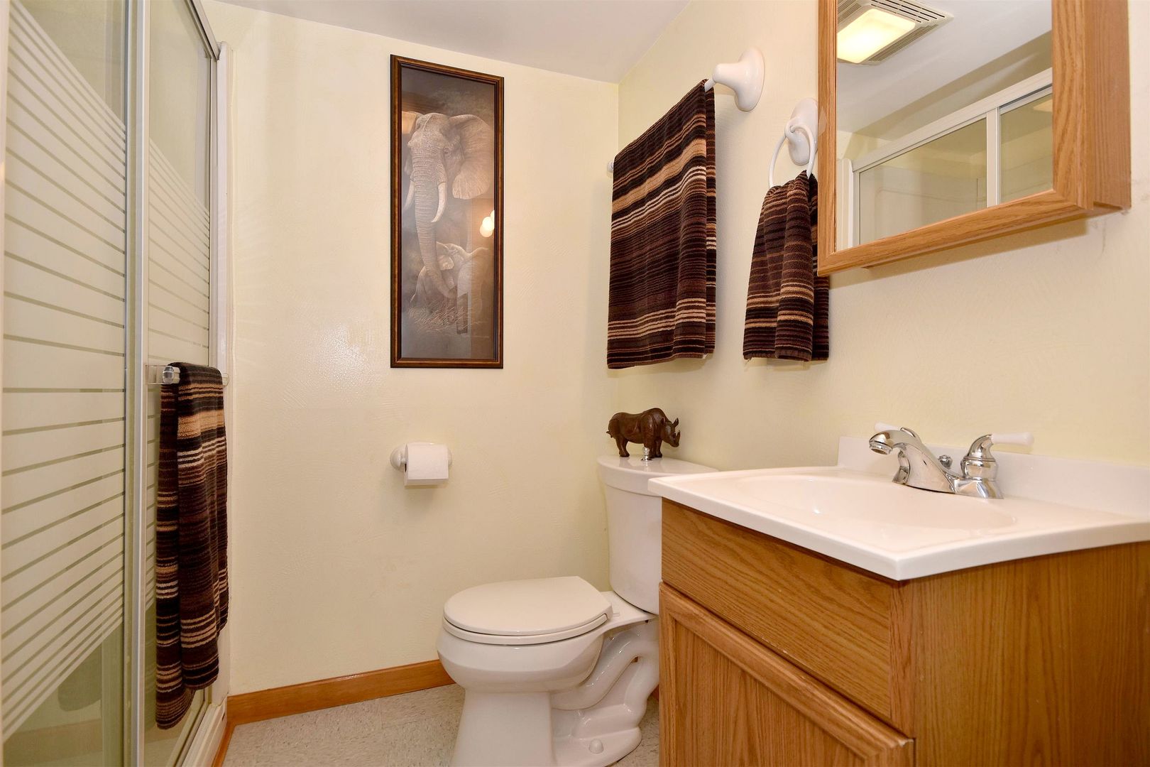 8423 Riverside Avenue Brookfield, IL 60513 - Photo 25 of 28 a bathroom with a sink and a mirror
