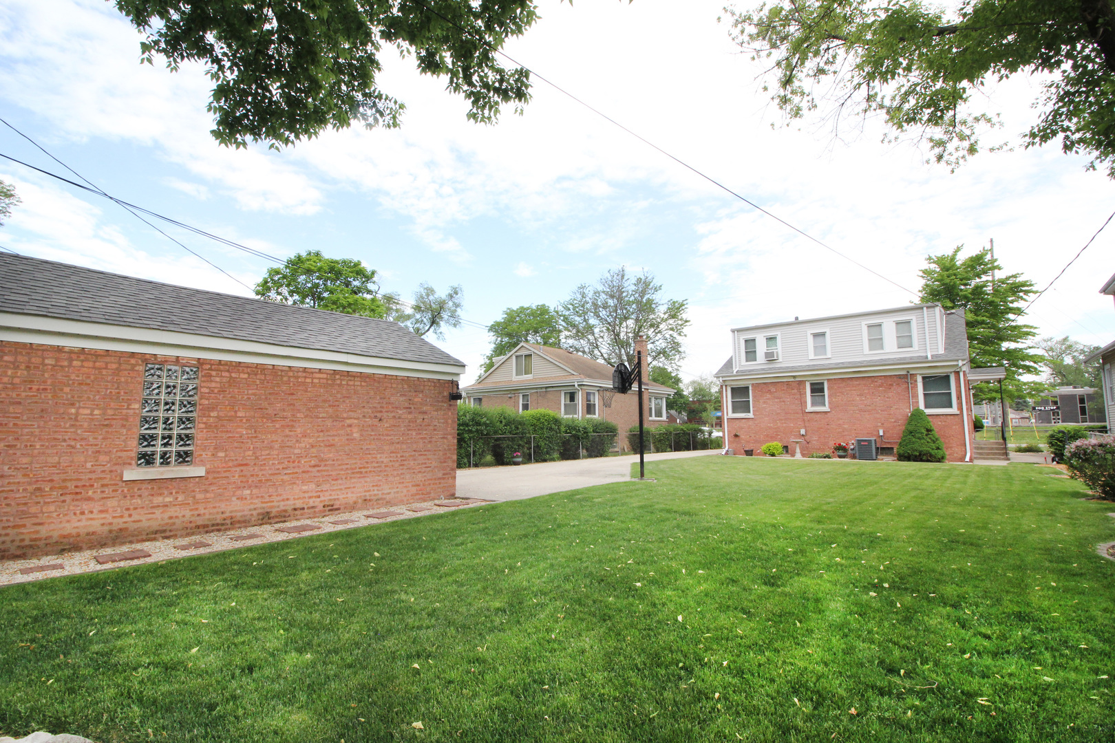 8423 Riverside Avenue Brookfield, IL 60513 - Photo 27 of 28 a view of a house with a yard