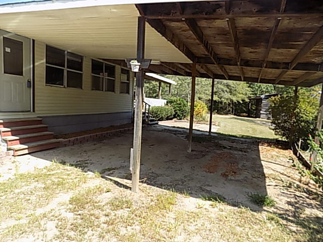 3294 South Lizella Road Lizella, GA 31052 - Photo 2 of 17 a view of a backyard of the house