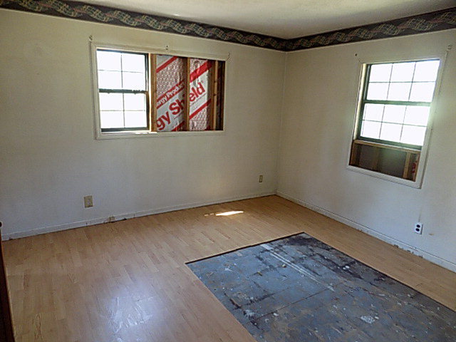 3294 South Lizella Road Lizella, GA 31052 - Photo 15 of 17 an empty room with wooden floor and windows