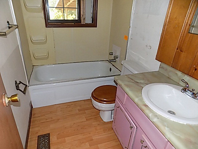 3294 South Lizella Road Lizella, GA 31052 - Photo 17 of 17 a bathroom with a sink a toilet and a mirror
