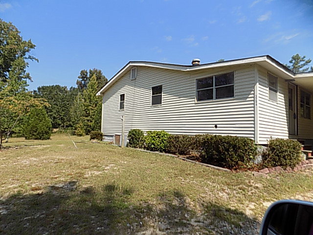 3294 South Lizella Road Lizella, GA 31052 - Photo 3 of 17 a view of a house with backyard and trees