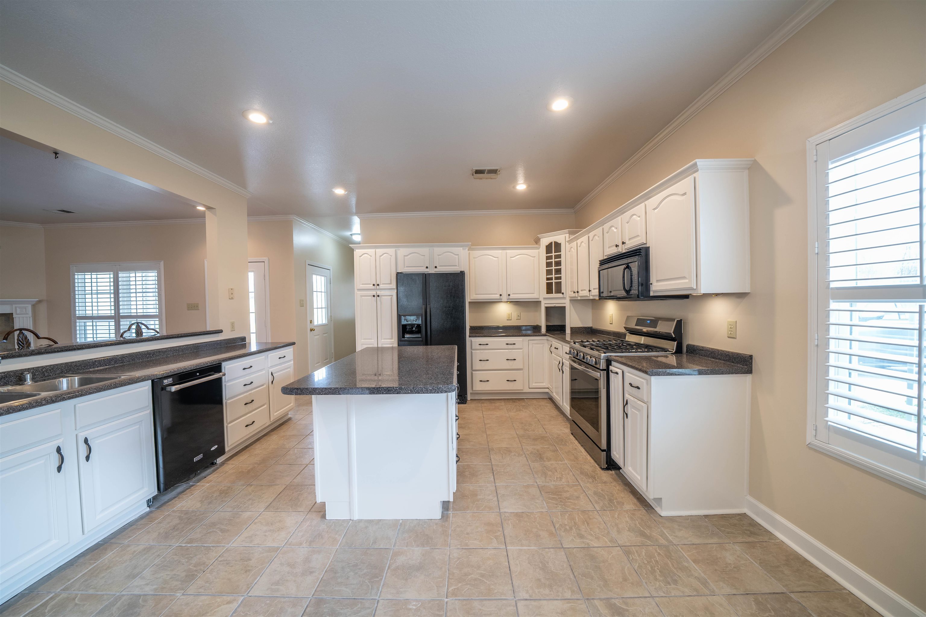 3740 Charles Bartlett Road Millington, TN 38053 - Photo 11 of 36 a large kitchen with stainless steel appliances lots of counter top space