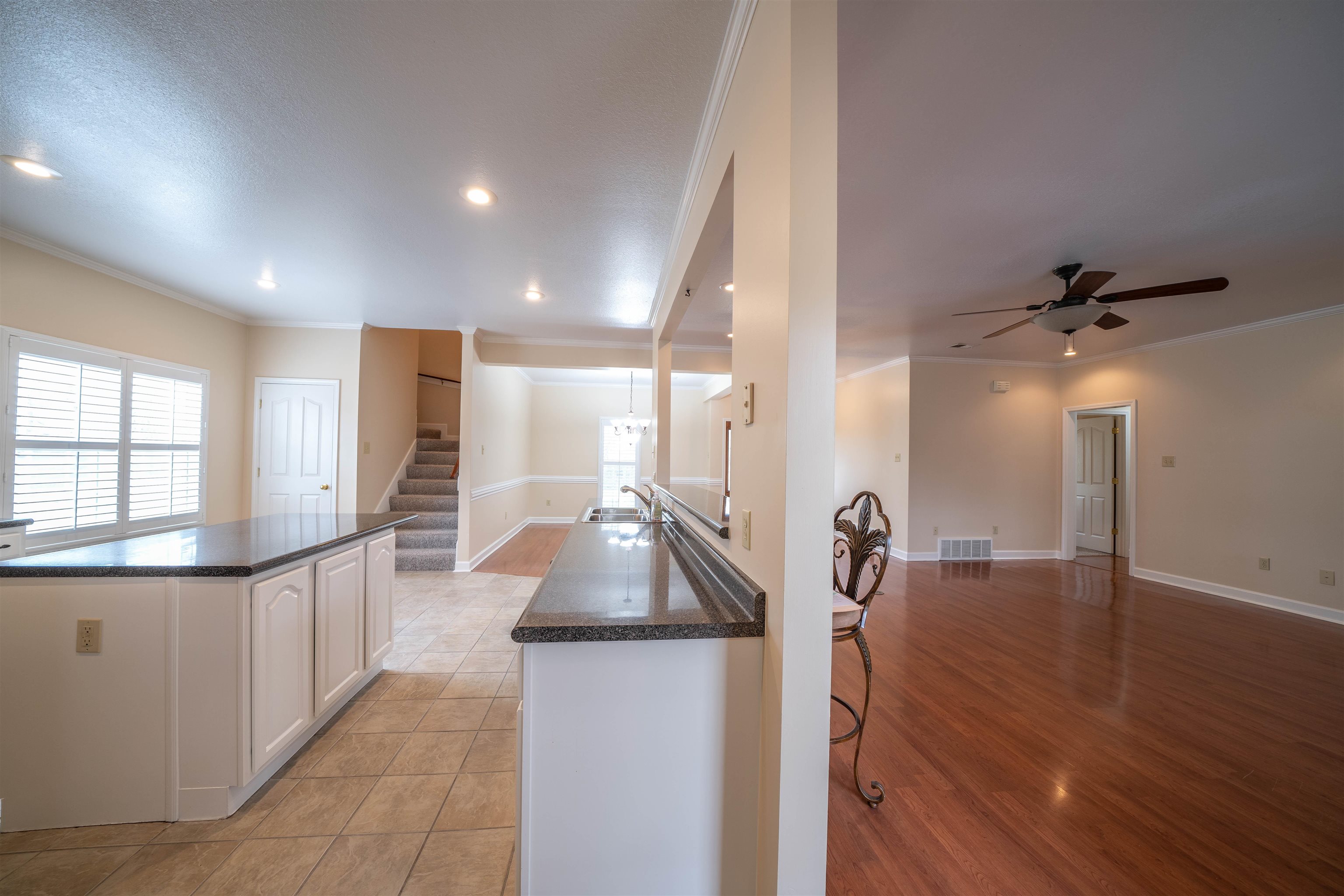 3740 Charles Bartlett Road Millington, TN 38053 - Photo 16 of 36 a open kitchen with stainless steel appliances granite countertop a refrigerator and a sink