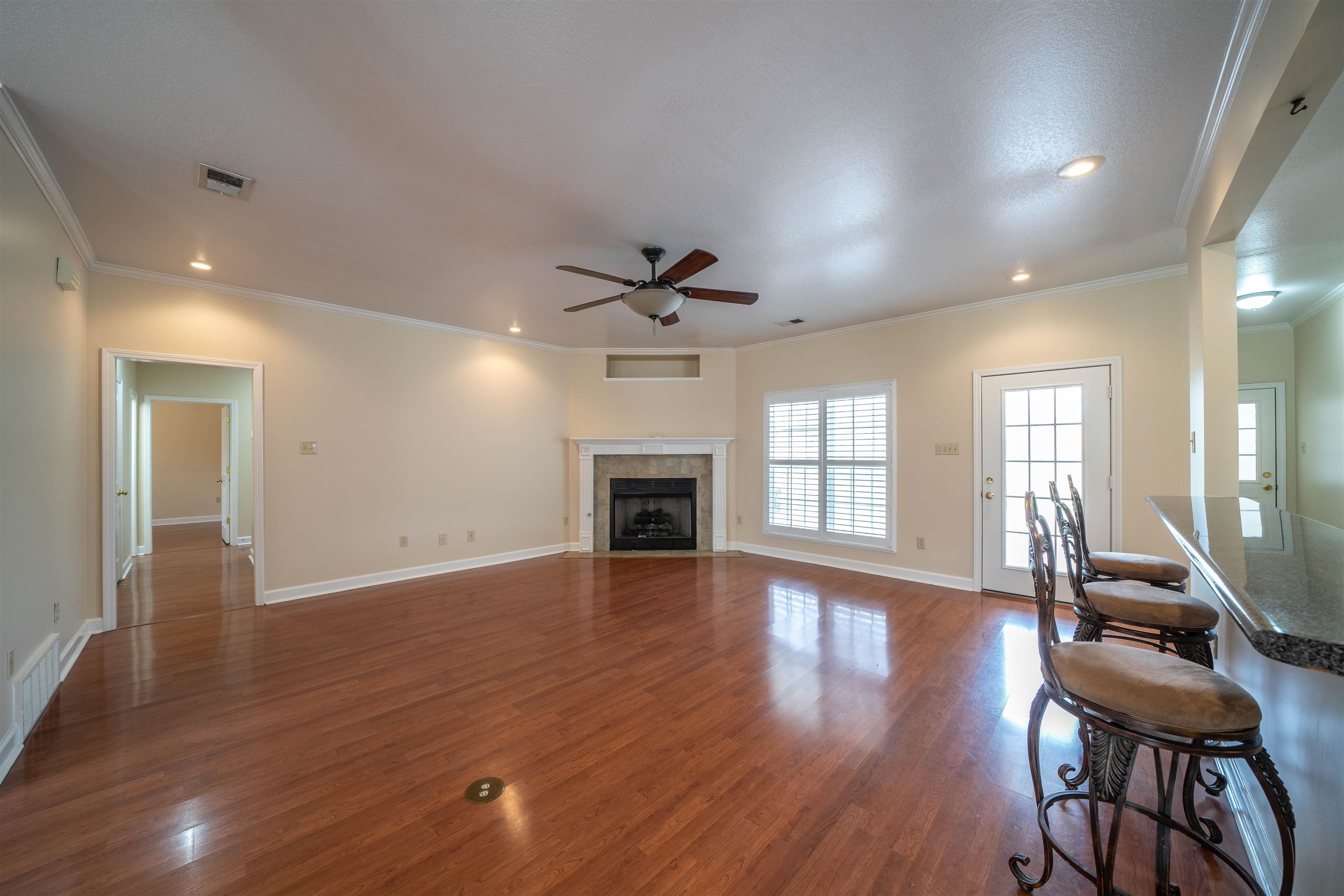 3740 Charles Bartlett Road Millington, TN 38053 - Photo 18 of 36 a view of an empty room with wooden floor and a window