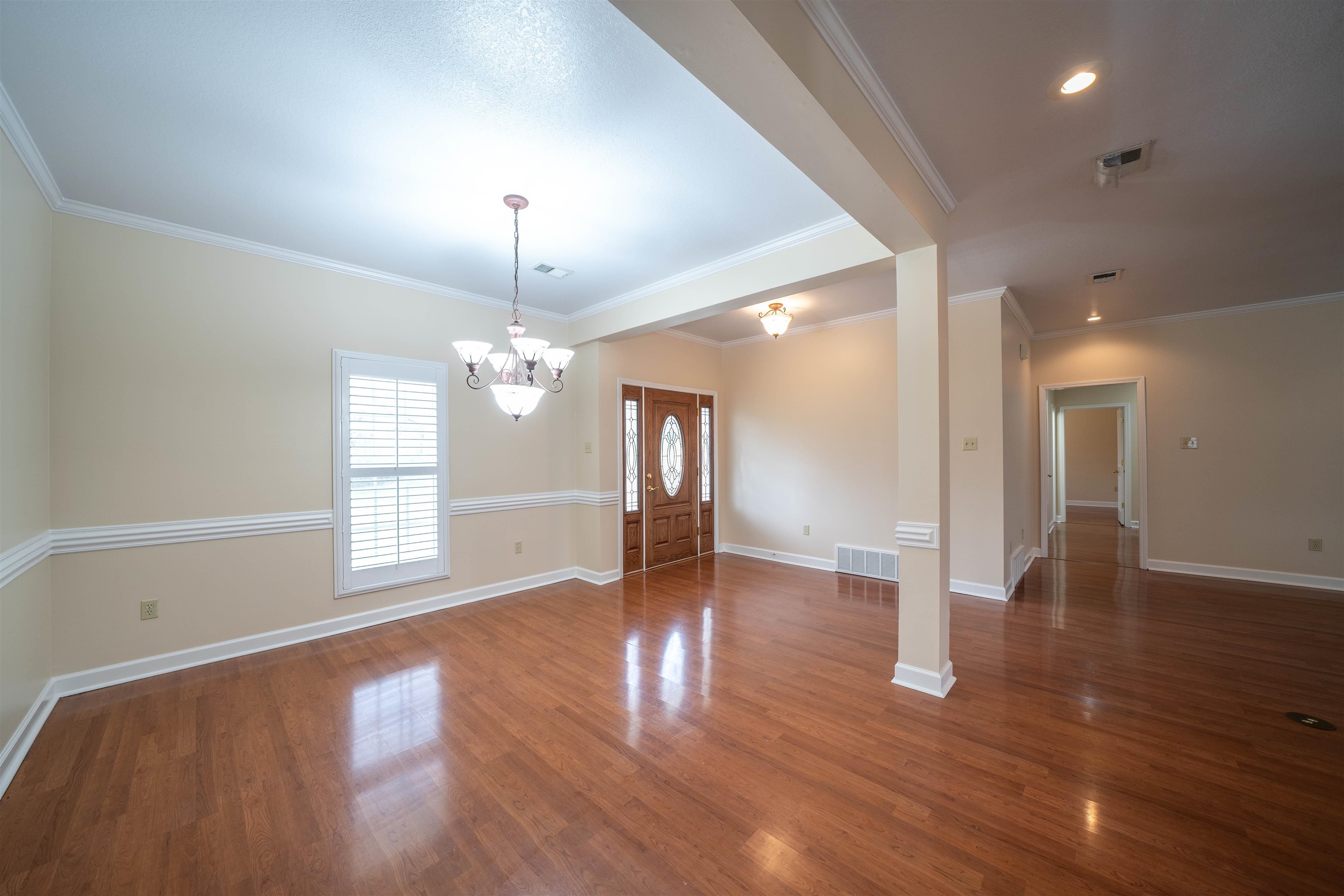 3740 Charles Bartlett Road Millington, TN 38053 - Photo 20 of 36 a view of an empty room with wooden floor and a window